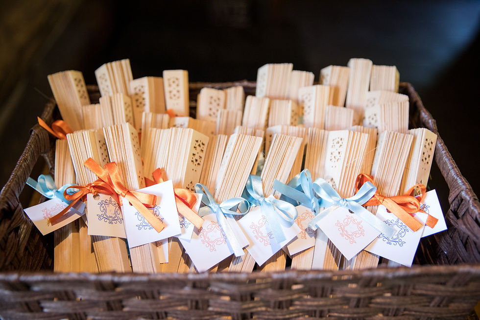 Wedding favor, sandalwood fans, with ribbon and monogram.