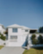 Exterior painting of a white weatherboard and rendered coastal home, McAskill Coatings Sydney