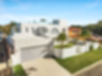 Aerial view of a white rendered and texture-coated modern home with arched windows, McAskill Coatings Sydney