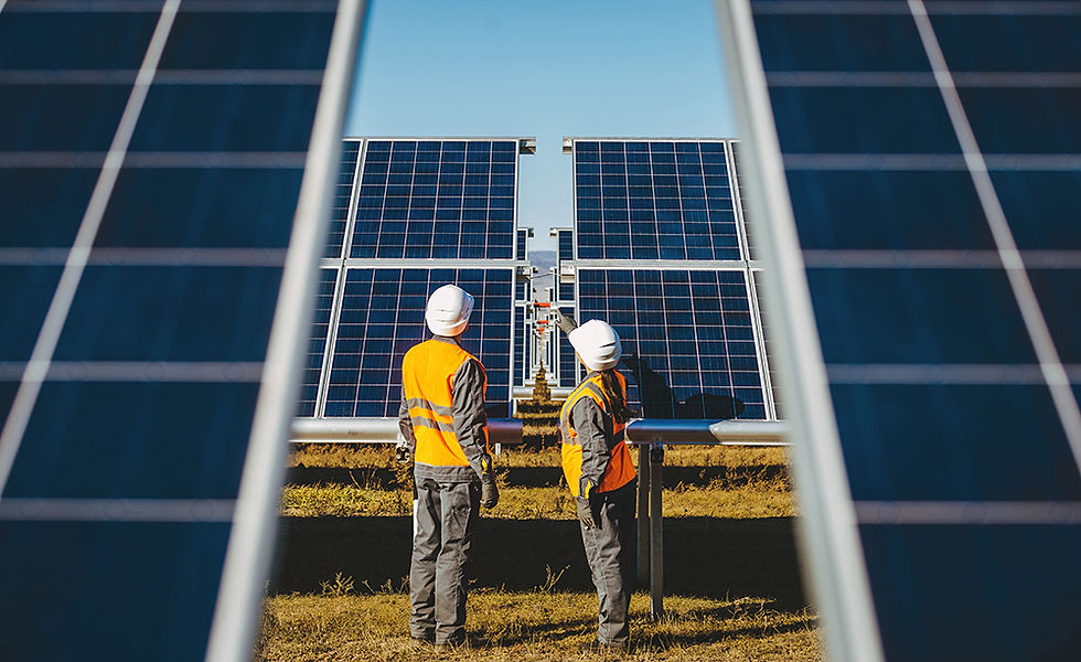 Technicians looking at solar panels