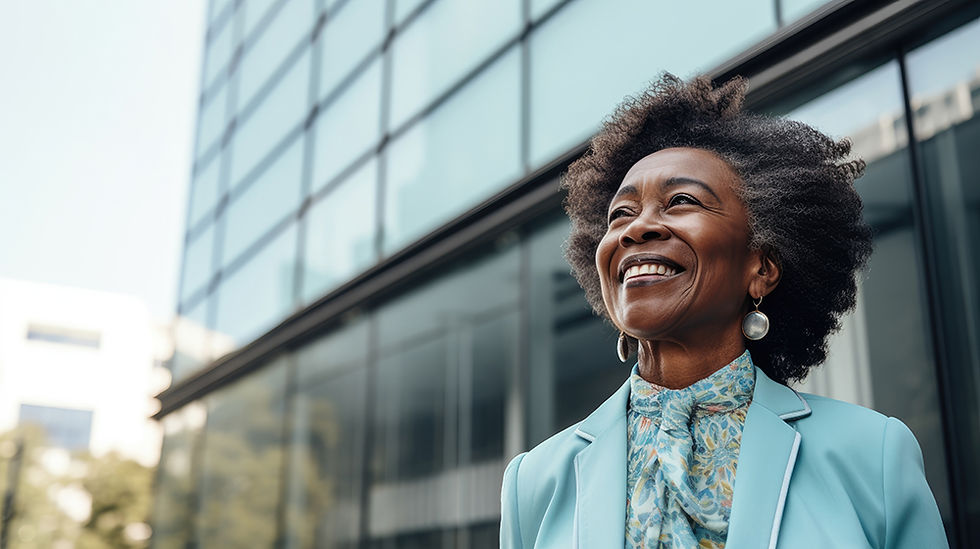 Nigerian business woman smiling stood outside of large skyscraper