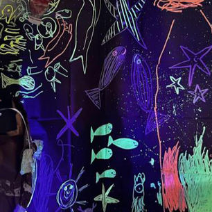 colorful drawings of aquatic life on a dark background