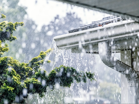 overflowing gutter, heavy rainfall