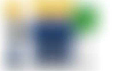 Four workers in blue uniforms and yellow helmets stand by a "Fire Assembly Point" sign. One holds a clipboard, pointing at them.