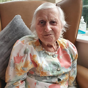 Elderly woman smiling at camera