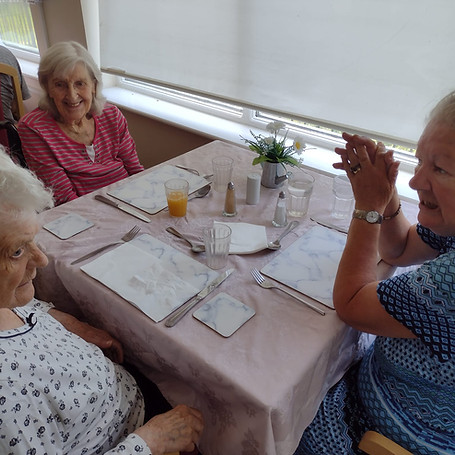 Group of elderly residents around a table