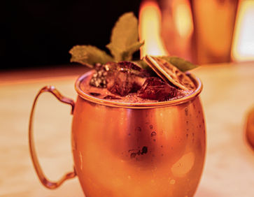 Minute Mule in a copper mug with mint and dried citrus.