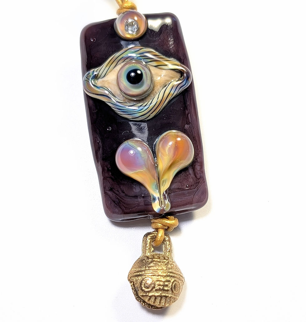 Third eye heart and bell necklace pendant close up top front  view