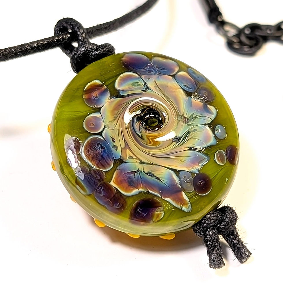 Thumbnail: Artisan lampwork twisted raku spotted pendant on black cord close up back right angle view