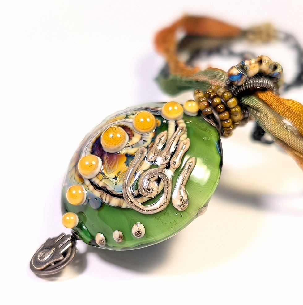 XL green lentil lampwork glass wire wrapped pendant front right angle