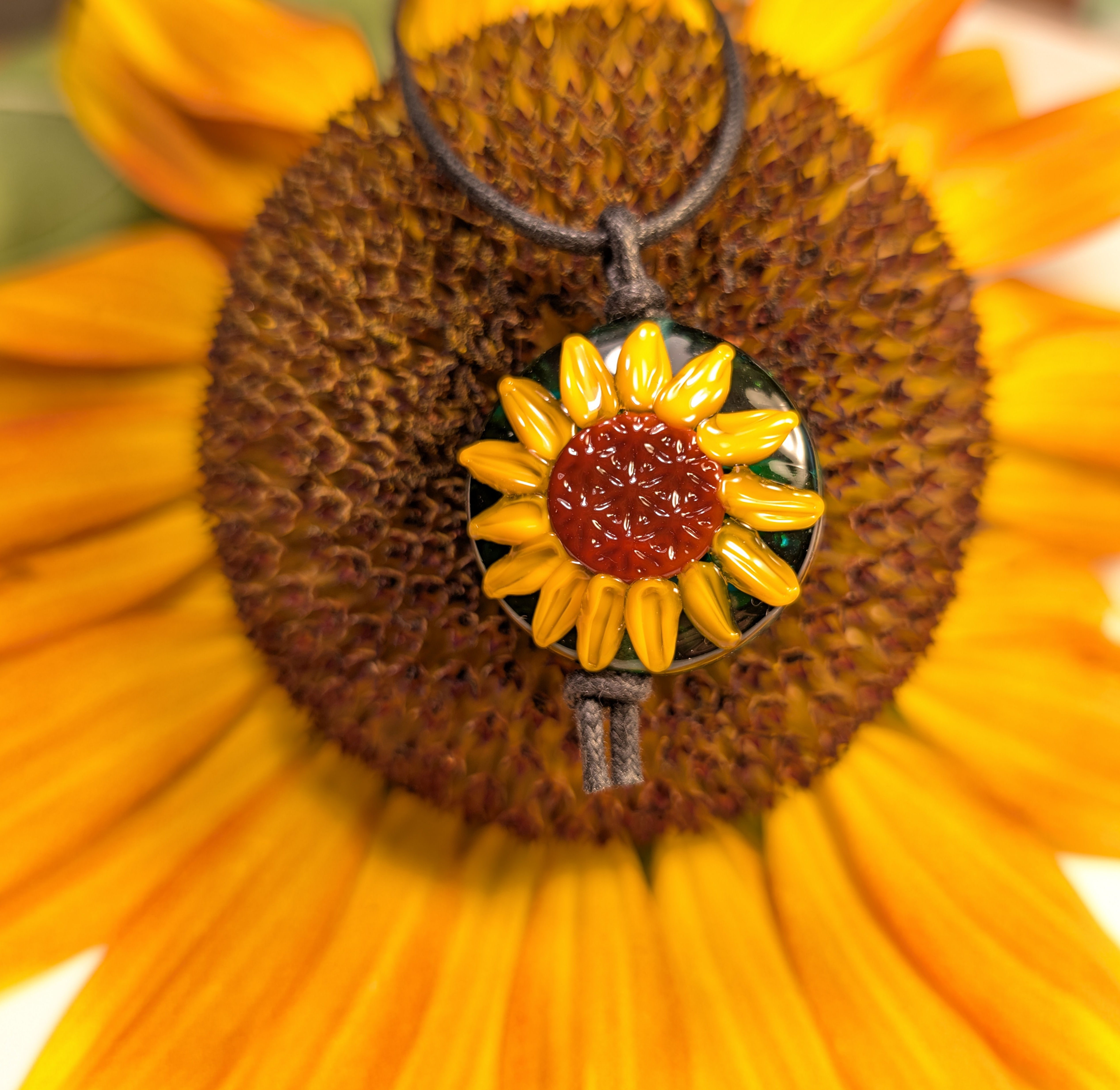 lampwork bead flower of life sunflower pendant on a sunflower