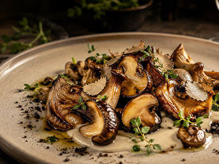 Fine dining mushroom dish with caramelized mushrooms, creamy purée, herbs, and elegant plating