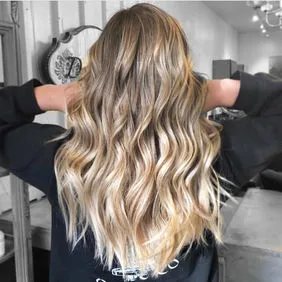 Long dimensional blonde hair with a smooth blended extension finish