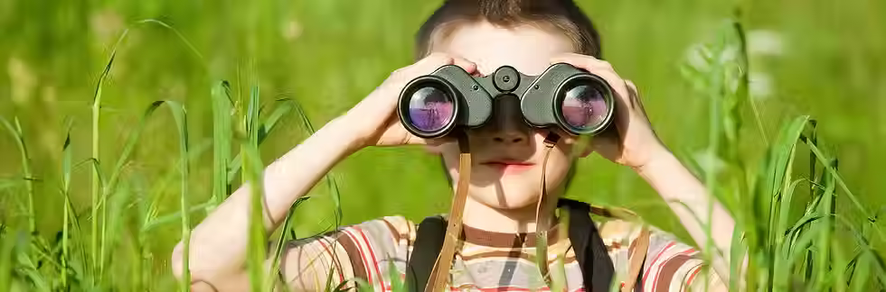 boy with binnoculars.avif