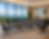 14ft Conference Table in Gray with Black Chairs. Table Legs have Gray Trim and Hide Wires.