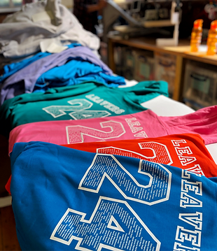 Levers hoodies spread out on table. All different colours