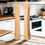 Thumbnail: A retro-style cream-colored toaster with wooden tongs sits on a wooden countertop in this kitchen scene. The toaster is the m