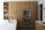 A photograph of sleek, modern kitchen cabinets.