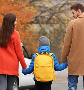 Parents supporting their child while navigating a Florida parenting plan