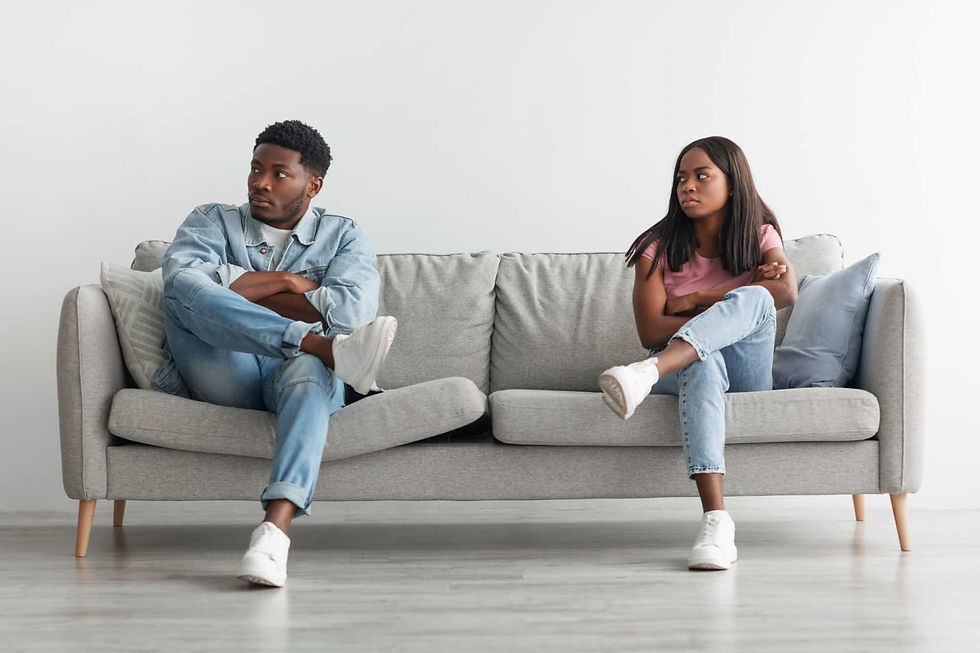 two people sitting on a couch thinking about how resentment is reliving the past