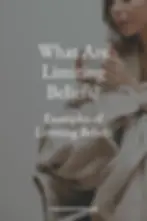 limiting beliefs - woman in a blanket holding a coffee