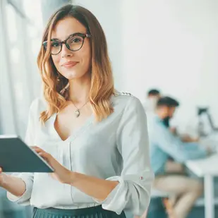Benefits of a Career Coach for Women – woman with glasses on an tablet