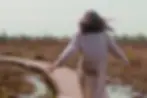 feeling lost in life woman walking on a boardwalk
