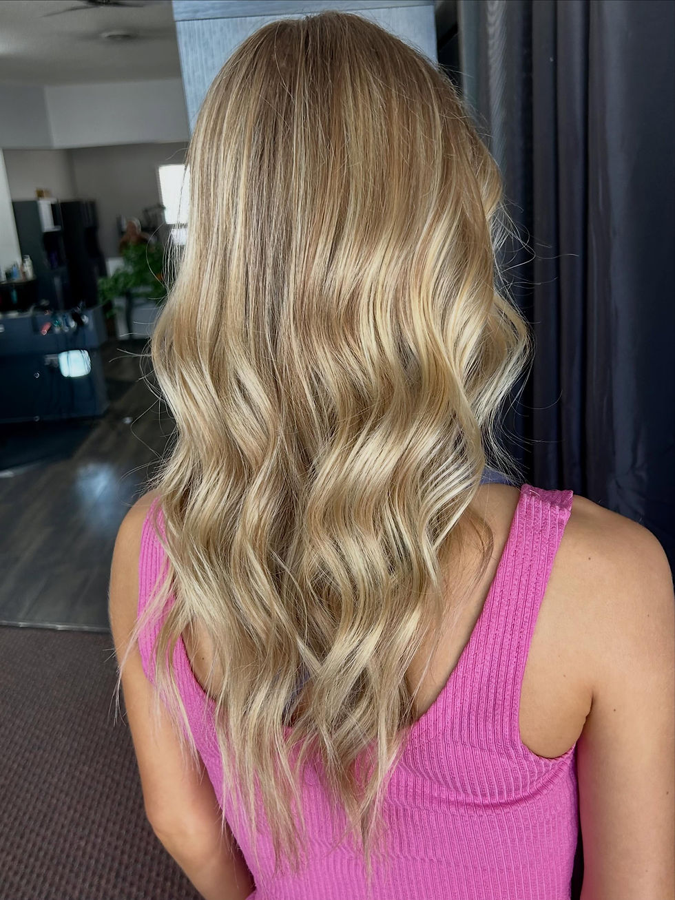 Dimensional blonde with soft waves at House of Holloway Salon in Lincoln