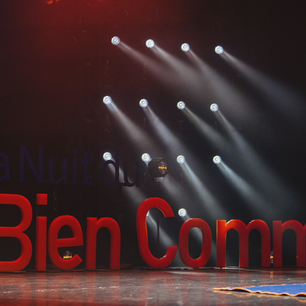 La Nuit du Bien Commun text and logo with stage spotlights in place.