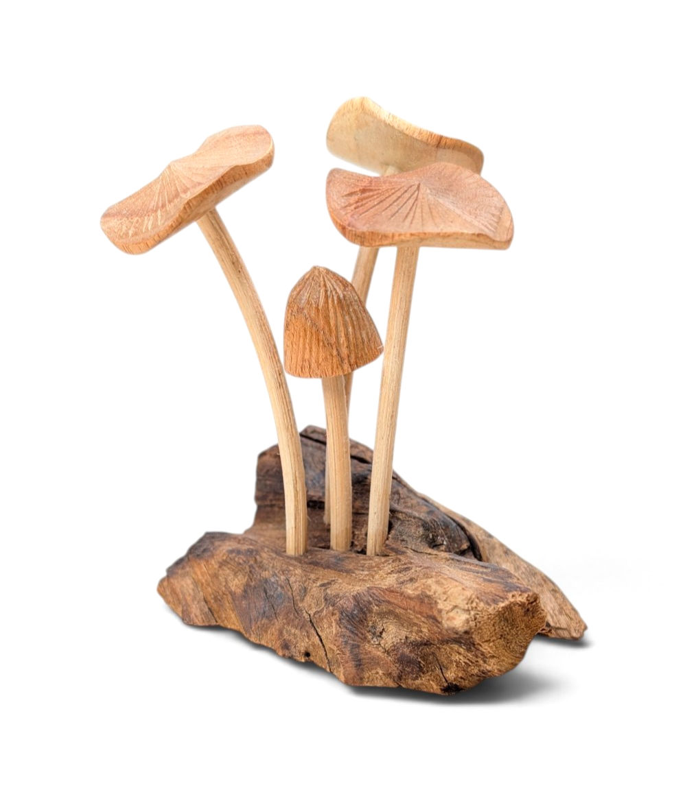 Small handcrafted mushroom figurine made from natural wood