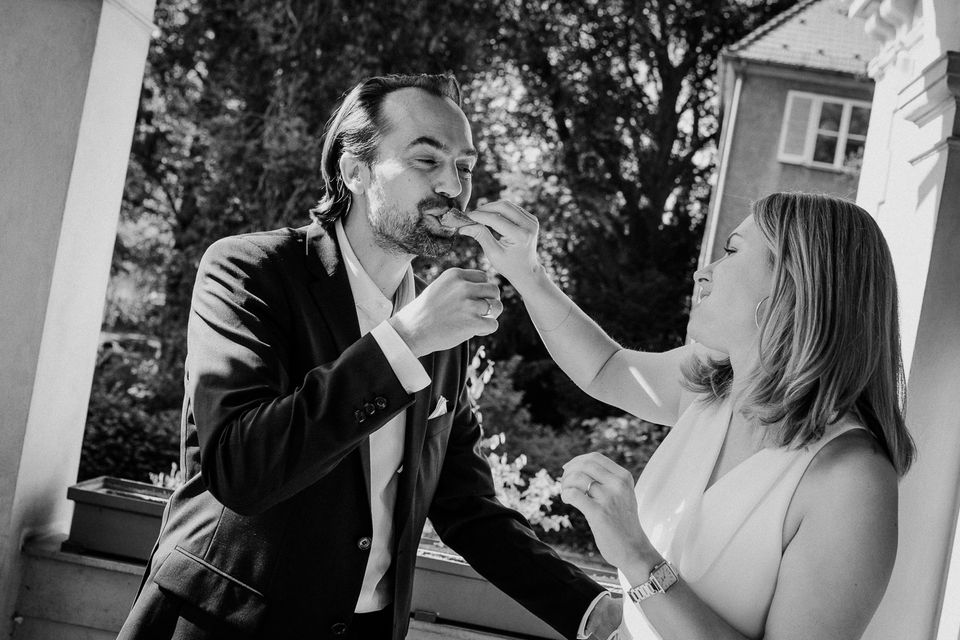 Bride feeding groom cake: wedding portfolio