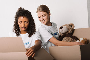 beautiful-female-volunteers-packing-toys-for-chari-2022-12-16-15-22-32-utc.jpeg