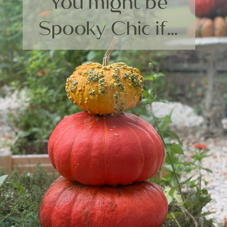 Stacked pumpkins in garden setting with text "You might be Spooky Chic if..." Greenery and orange hues create a festive autumn mood.