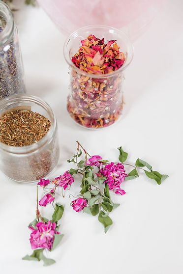 A collection of dried flowers, herbs, and small gathered treasures.