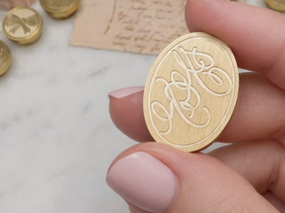 Oval wax seal with initials H R engraved in script writing