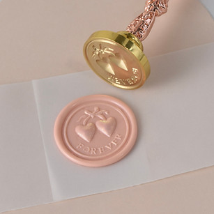 Wax seal with two hearts, Sonya.Love.Creative HOME on light pink background.