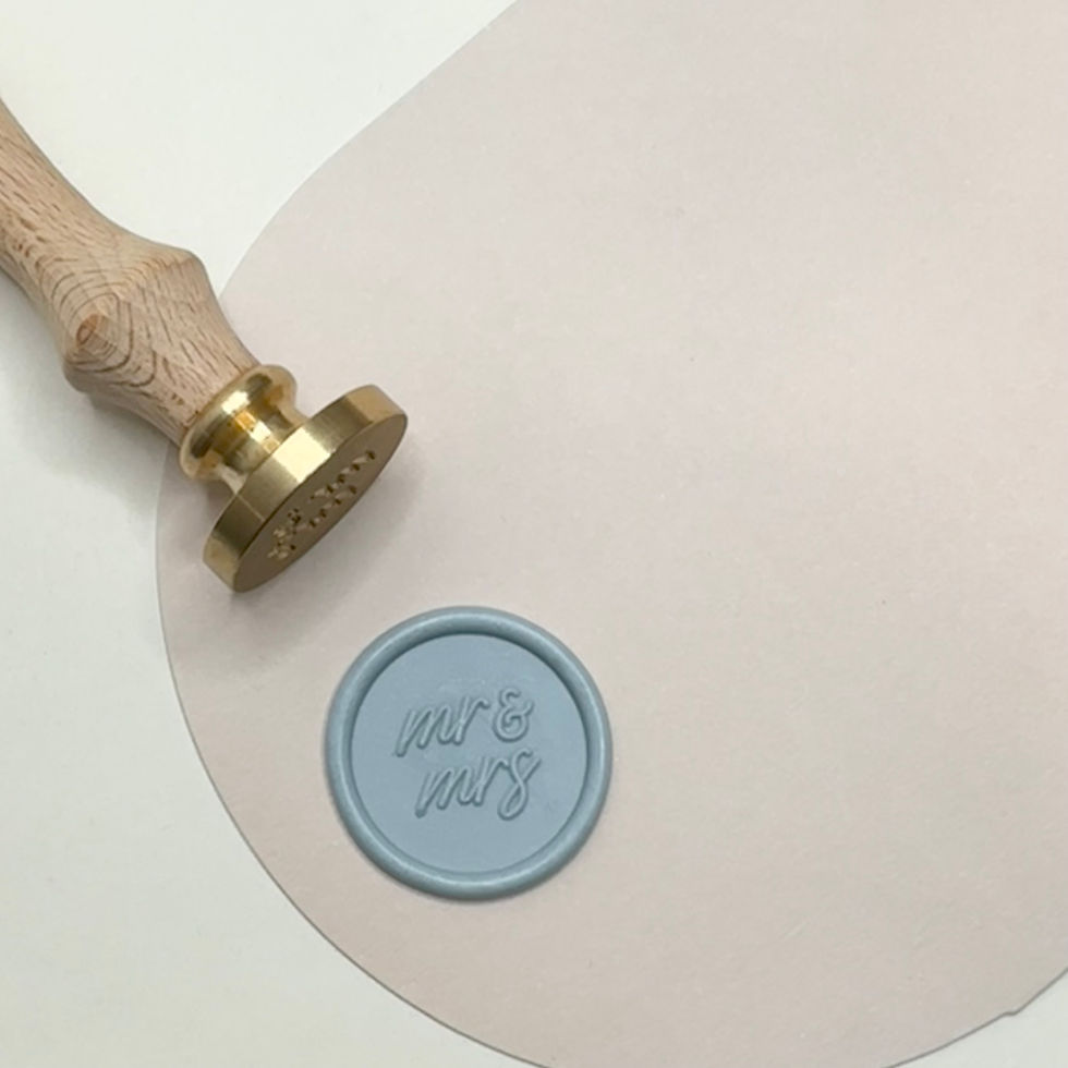 Mr & Mrs wax seal in a blue grey on decorative background with stamp