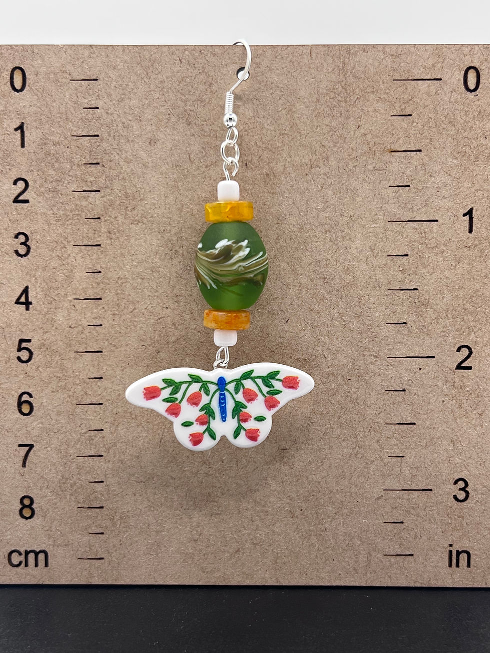 Thumbnail: White Butterfly Folk dangle