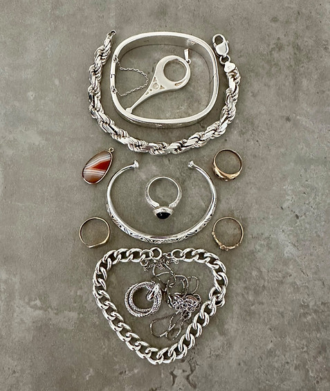 Gold and silver jewellery items purchased from a client from Lindfield at the Haywards Heath office, including bracelets, rings, a pendant and other precious metal pieces.