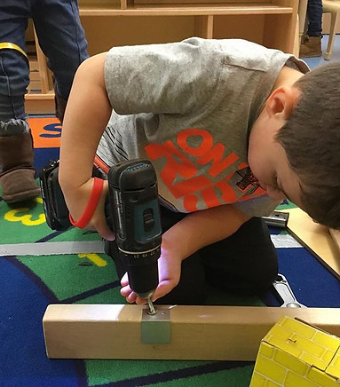 Students at Z099 are learning how to build a house in our “Where We Live” unit. They got t