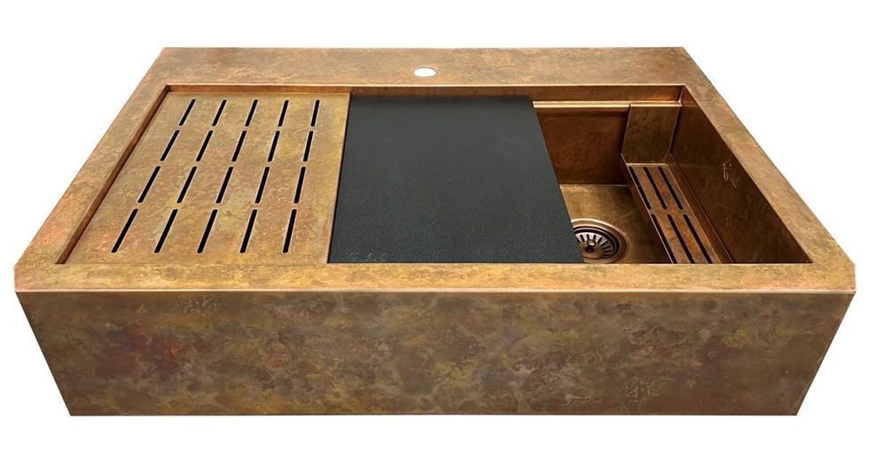 Copper sink with black cutting board and Rachiele visible accessories.