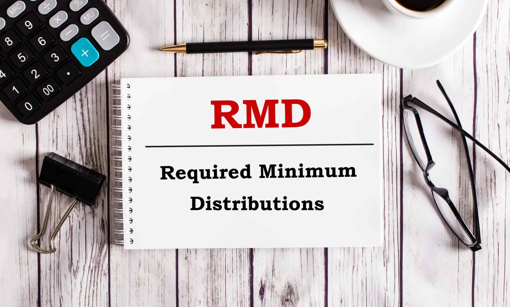 RMD Required Minimum Distributions written on a notebook