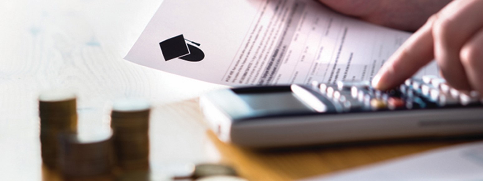 Graduation mortarboard icon on a document near a calculator