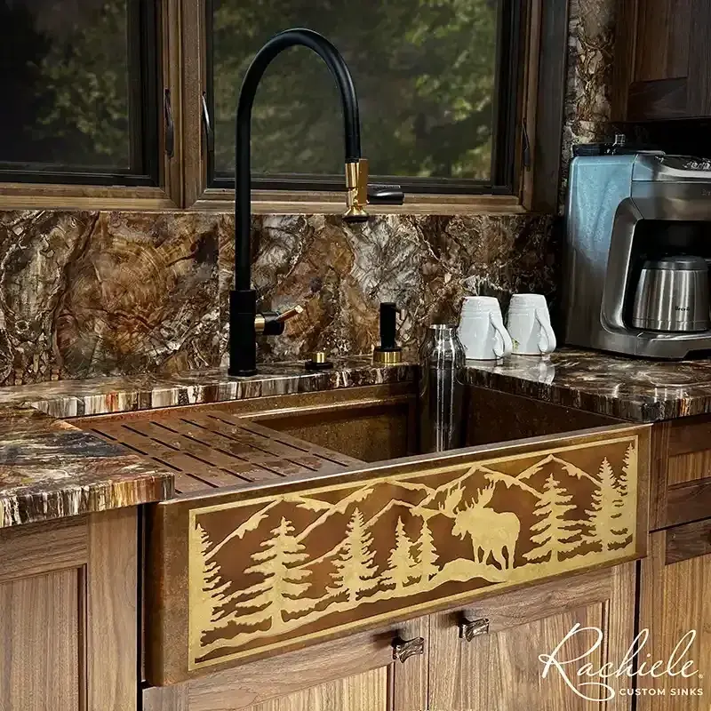 Copper farmhouse custom sink with Bronze inlay of a moose in a forrest