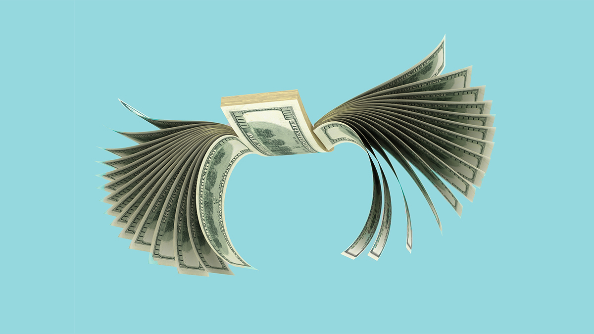 Stack of one hundred dollar bills with wings flying