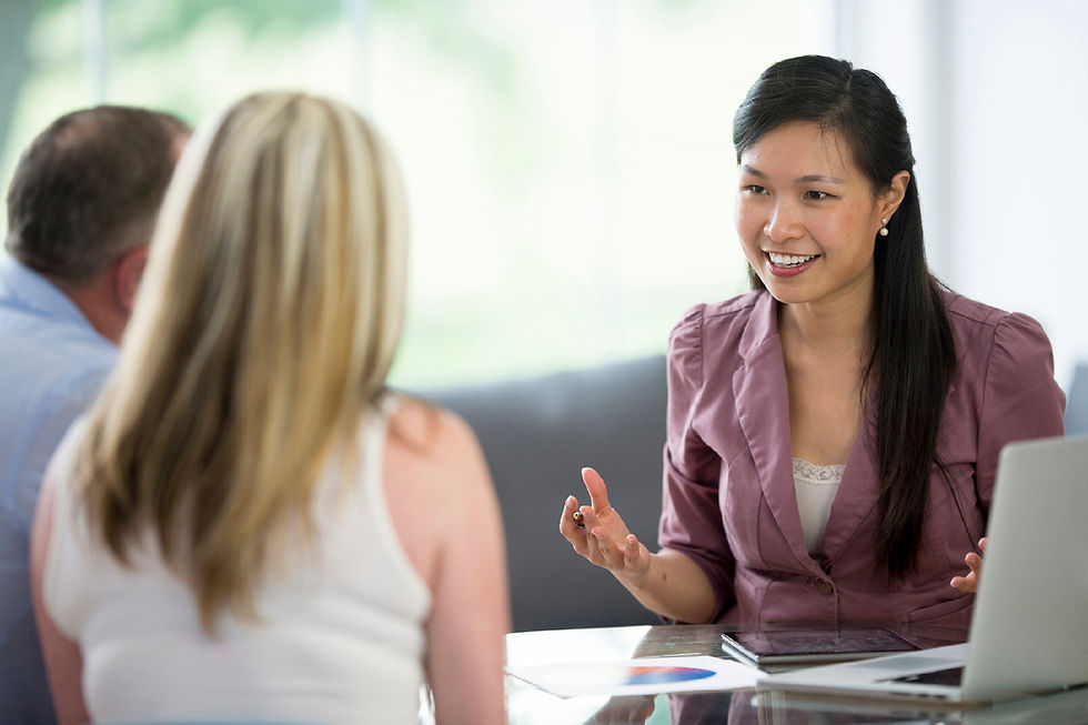 Professional consultant discussing home backup options with a couple.