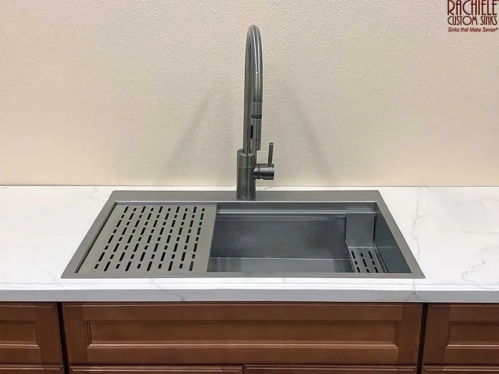 Stainless steel kitchen sink with Culinary Dock™ Patent Pending and Rachiele.