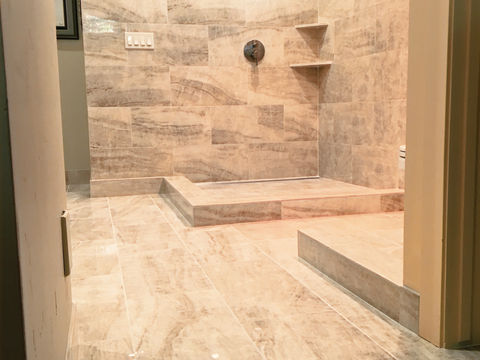 Staggered glossy classic porcelain tile bathroom.