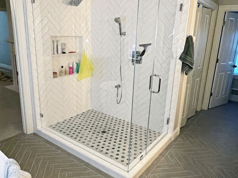 Herringbone shower and bathroom floor.