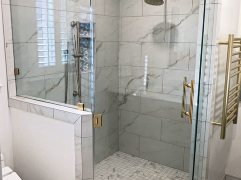 Carrara gold bathroom.